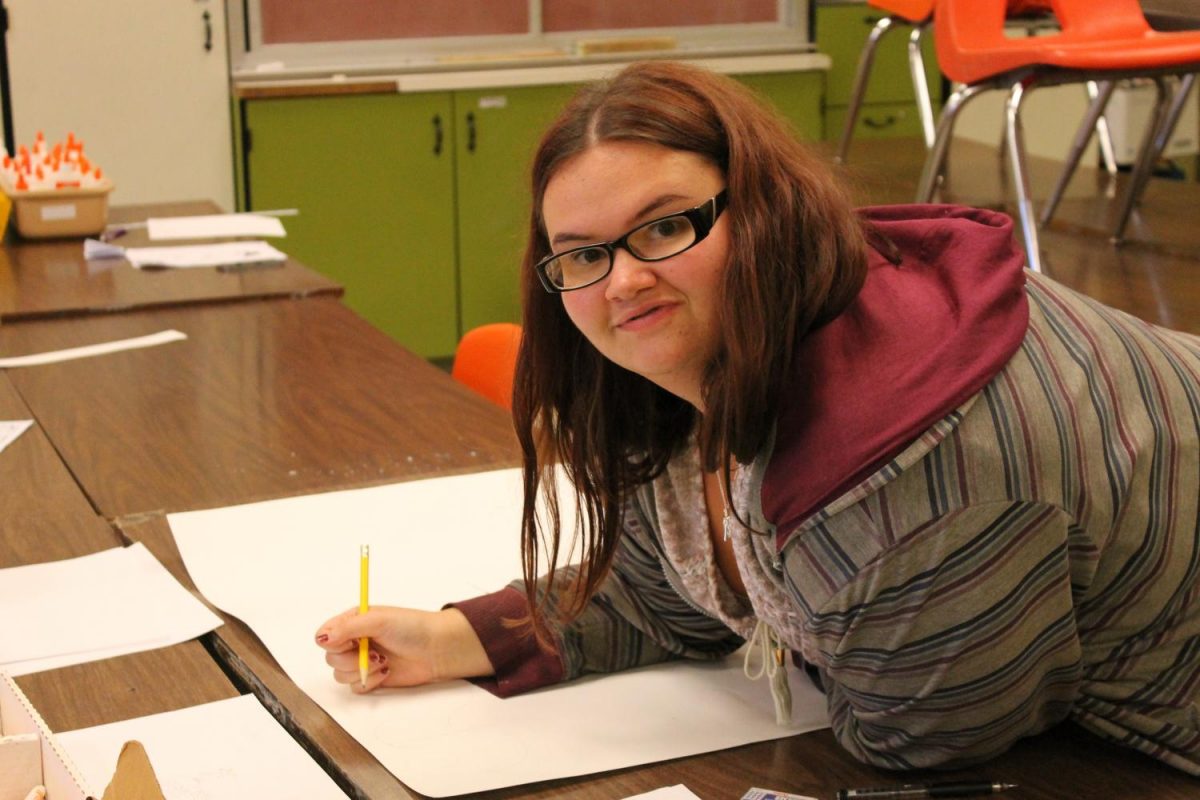 Brittany Francis gets ready to create a poster.