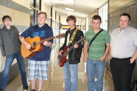 Mr.Maas, Hunter Bellew, Jacob Pinkley, Devin Martin, and Brent Turnbough pose for the camera with their guitars.