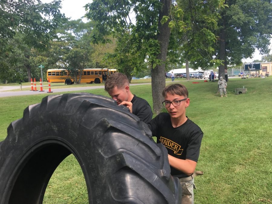 Carson Stephens and Jeffrey Wilson Flipping a tire.