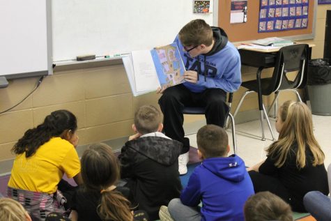 Easton Elrod reading to Mrs. Walkers class.