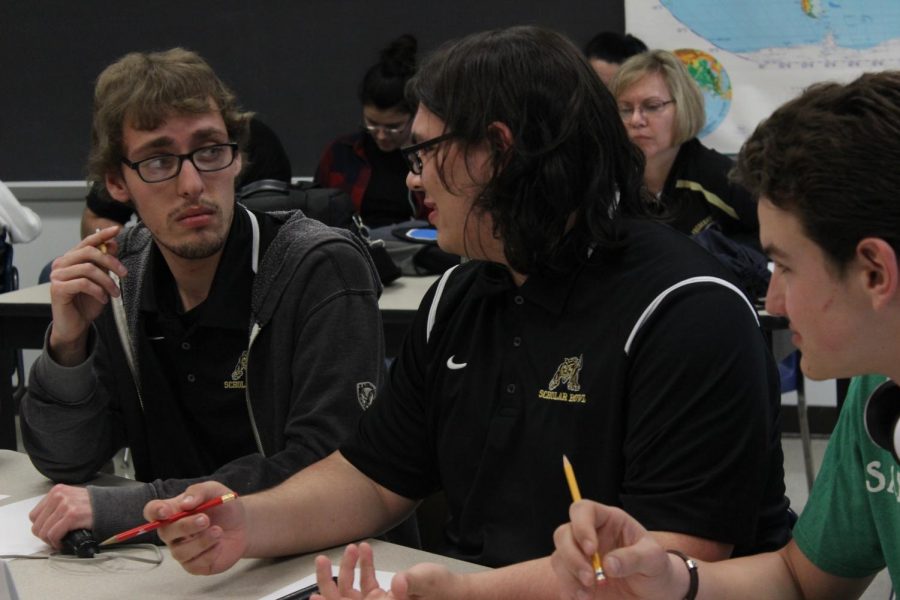 Cody+Phillips+and+Carter+Corcino+discuss+answers+during+a+bonus+round.