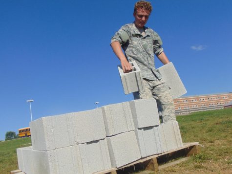 Jerritt Hargis lifts cement blocks for a challenge