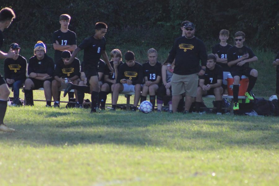 The FHS Soccer team sitting during a game