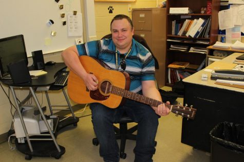 Mr. Maas showing off his acoustic guitar.
