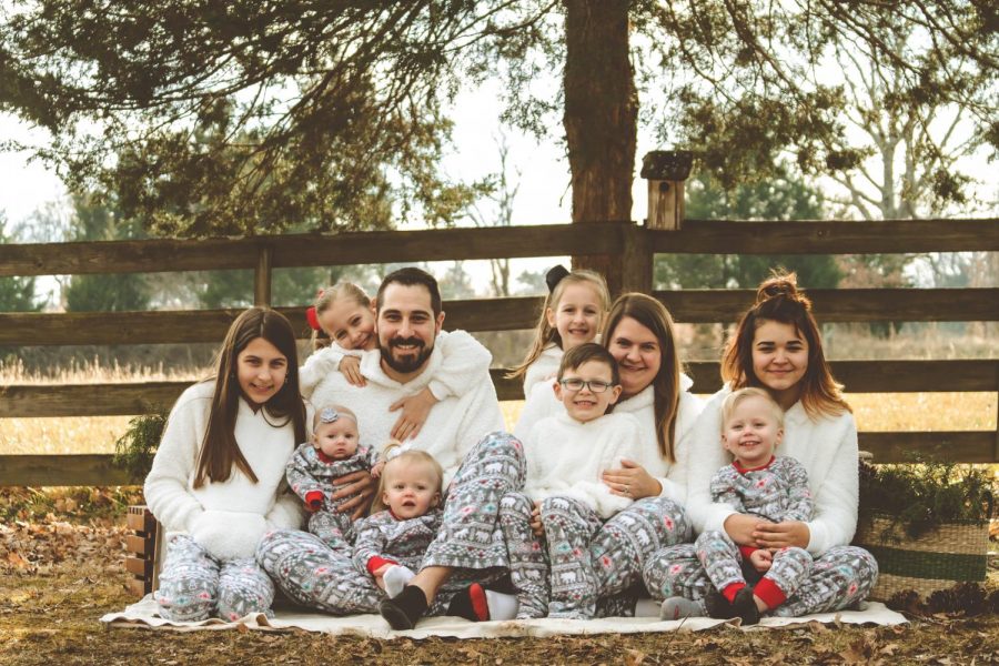 The Leach family posing for a Christmas picture, 