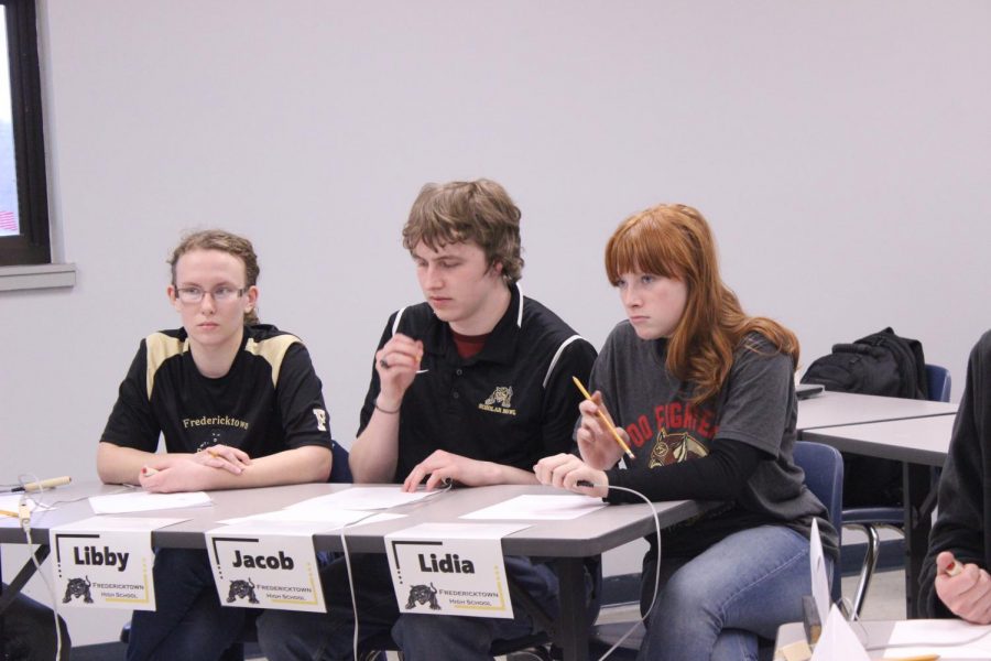 (From left to right) Libby Mooney, Jacob Mungle, and Lidia Myers answering the tough questions at a meet in February.