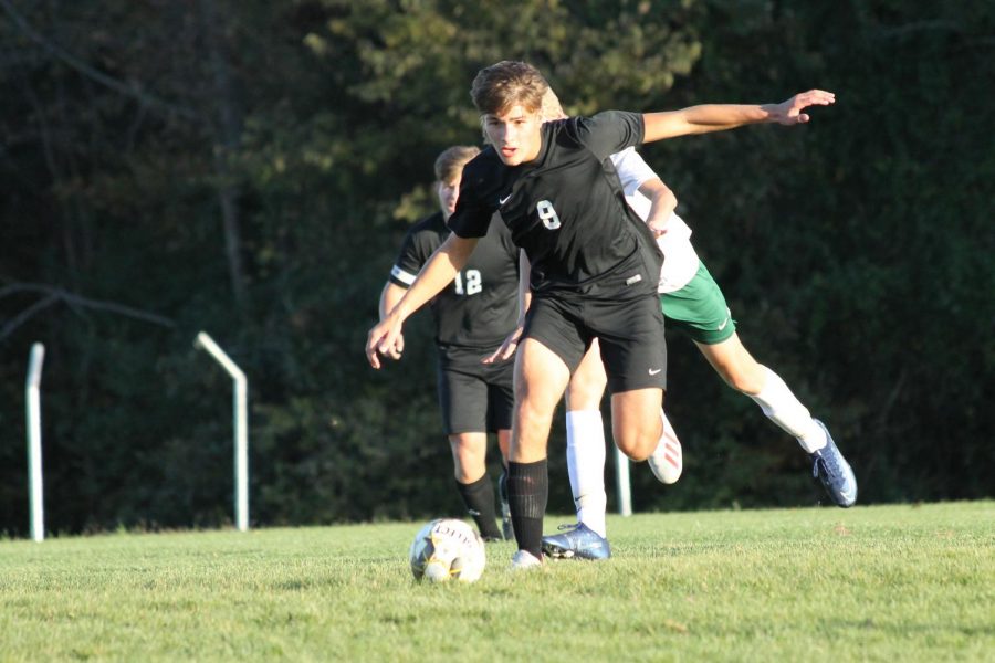 Junior Dawson Buford, 9, dribbles the ball towards Perrvilles goal.