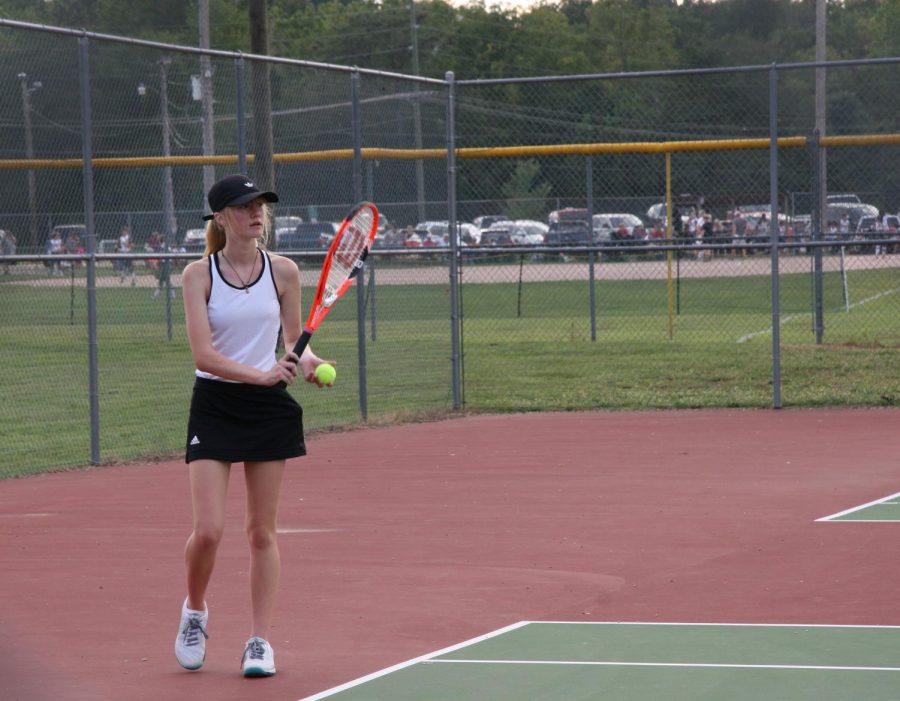 Junior Liz Hinkle, who won 3rd in districts, plays a singles match.