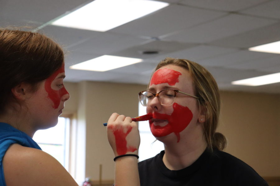 Julianna Miller (11) uncomfortably getting her face painted.