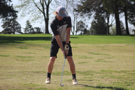 Wesley Dulany (9) lining up to drive the ball towards the hole.