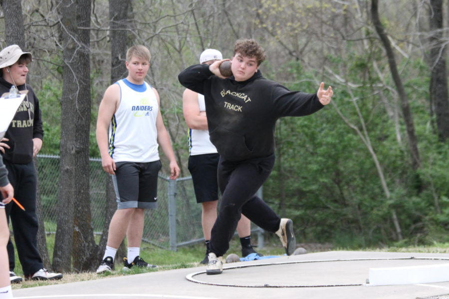 Marshall Long (11) throwing shot put during Districts at St. Genevie.  