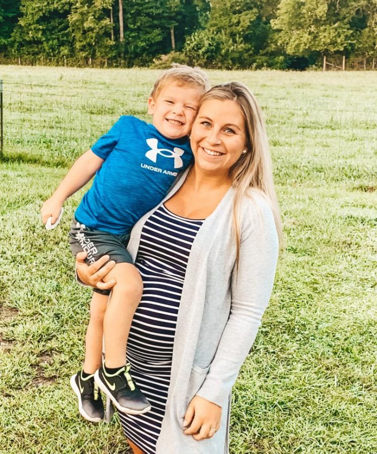 Mrs. Gifford shares a hug with her son while waiting for the arrival of a new sibling.