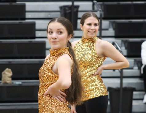Ava Hovis (9) and Layni Kinkead (12) at the boys basketball game against Central, posing at the end of their performance!