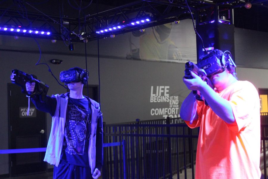 Cody Rpdger and Rion Fuson playing the VR games. 
