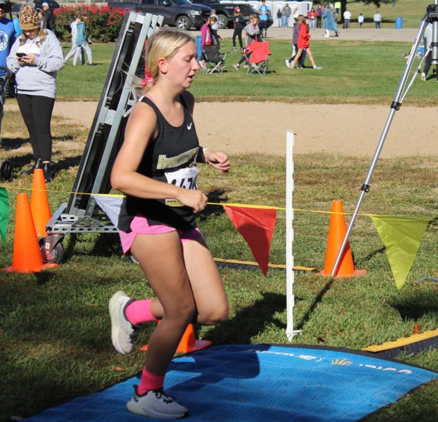 Laci McClellan (10) crossing the finish line at the cross country meet in Potosi. 
