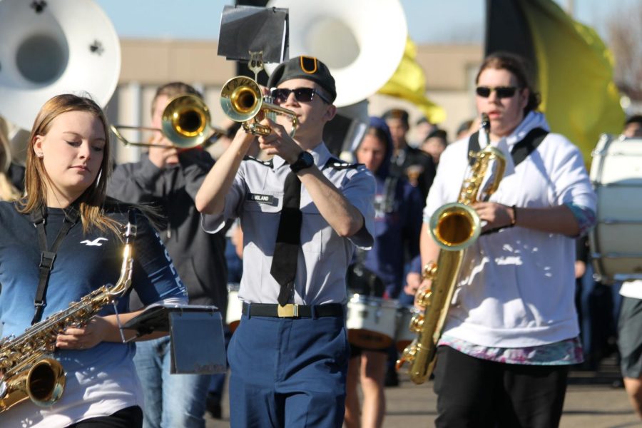 Eli+England+%2812%29+playing+the+trumpet+while+marching+in+the+Veterans+Day+parade.