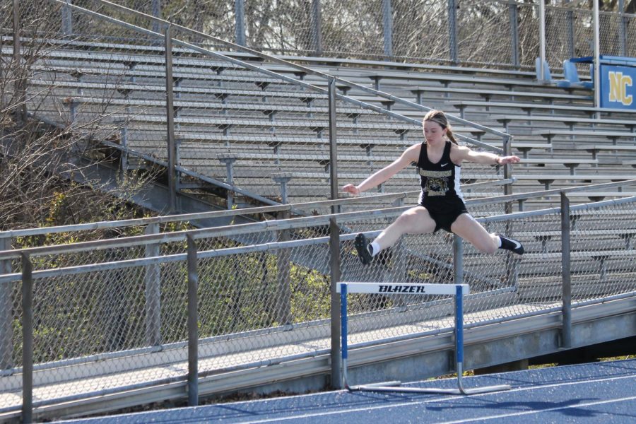 Kinleigh Gresham (10) jumping over the first hurdle in the 300m hurdles event.