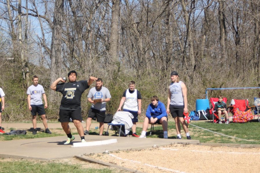 Owen Henson (10) throwing in the shot put event.