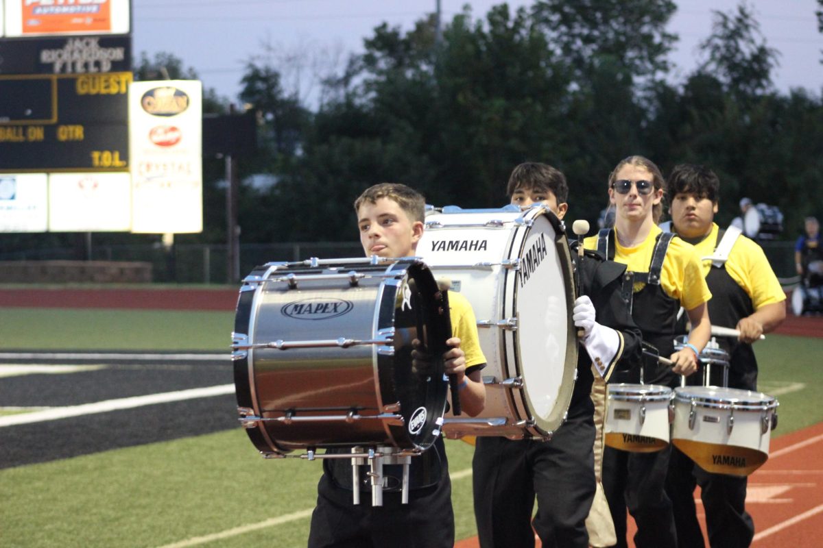 Oliver Shults (9) leading percussion line for the drumline exhibition. 