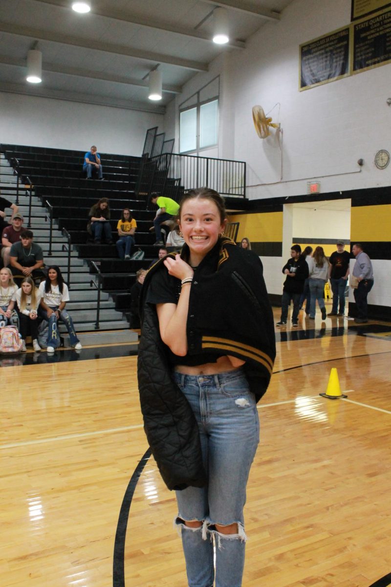 Kinleigh Gresham hugged a letterman jacket as the game was cutting down to the final 10. 