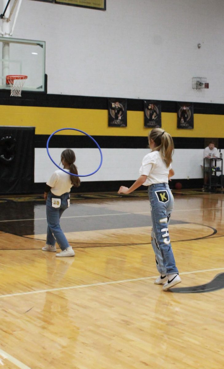 Katie Crites (12) and Dani West making the win for the seniors during the hula hoop game. 