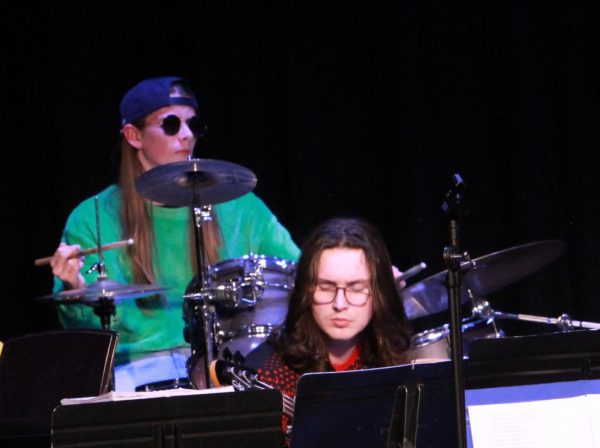 Brothers Simon Kelly (12), playing the drums, and Landon Kelly (12), playing the bass guitar. 