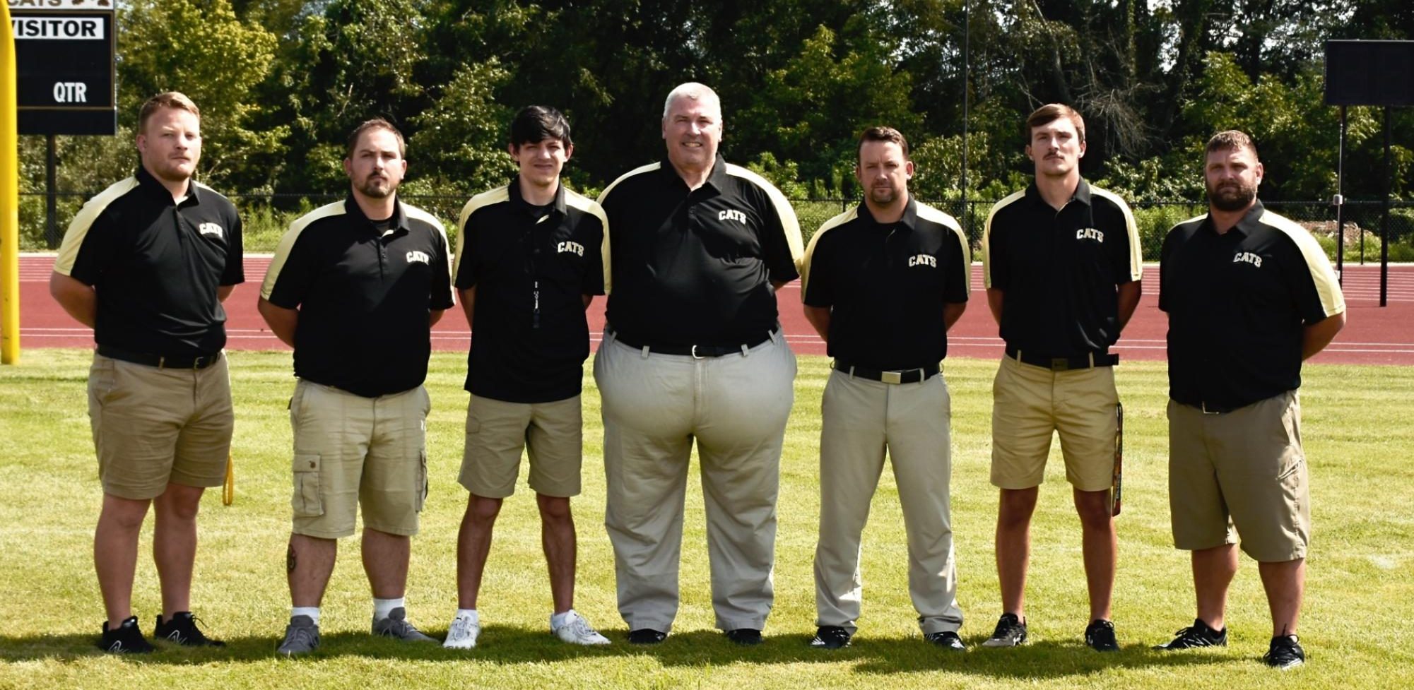 Head Coach Steve Williams surrounded by his Blackcat football coaching staff. (picture by Lifetouch)