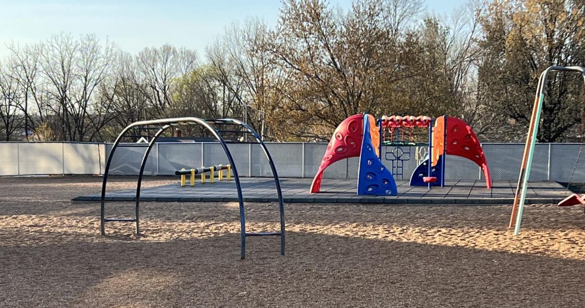 A current picture of the elementary playground with the privacy fence. 