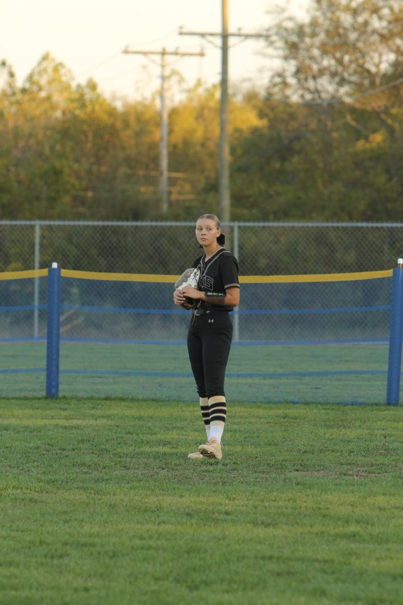 Braelynn Sarakas (12) ready for the opposing team to bat.