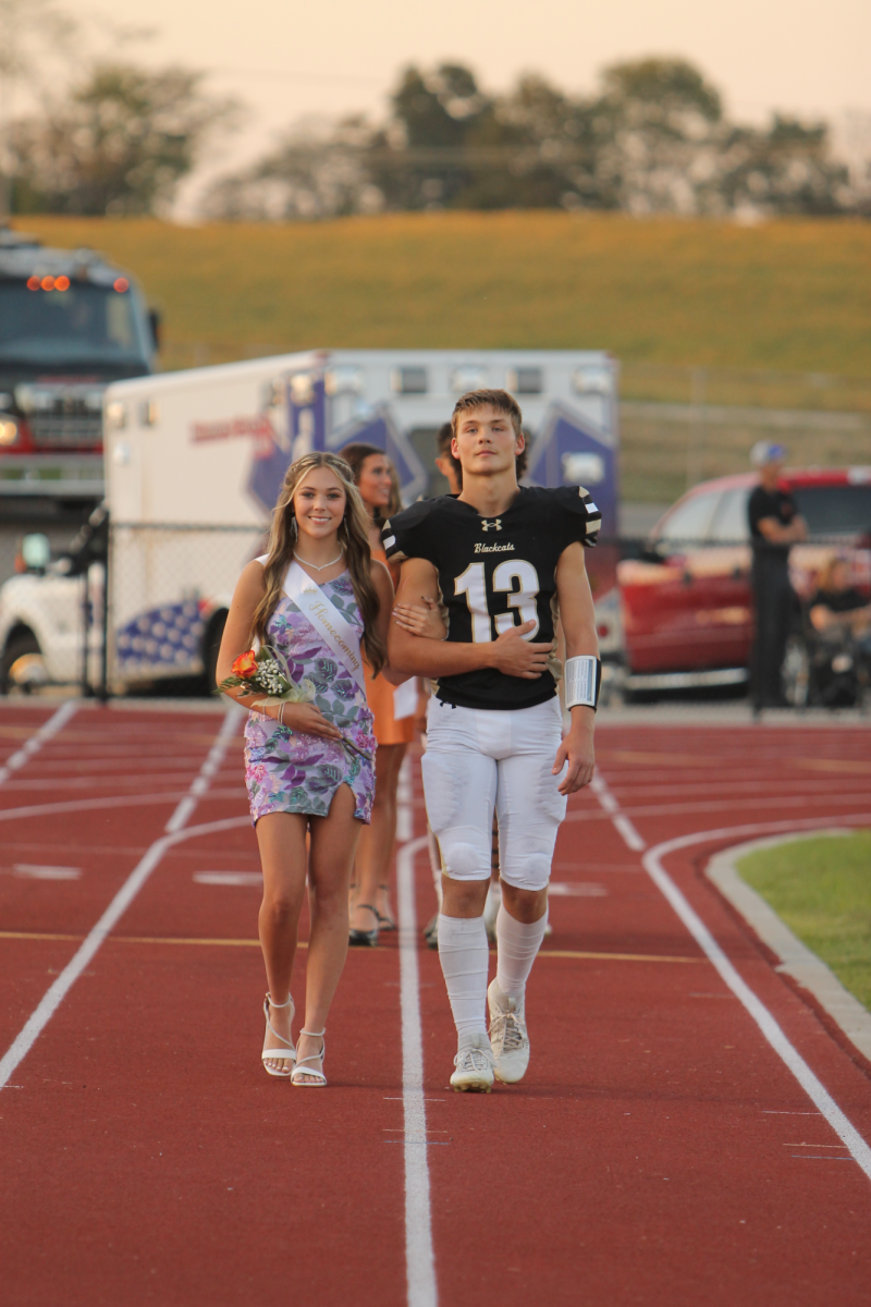 Hannah Rehkop and Easton Wood standing proud as they make their way to the center. 