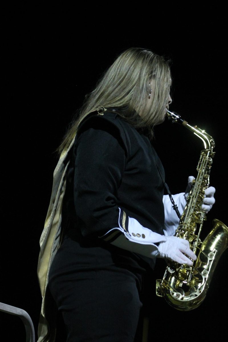 Adrienne Cox (11) performing a solo during the last song, a great addition and honor for her to continue play. 