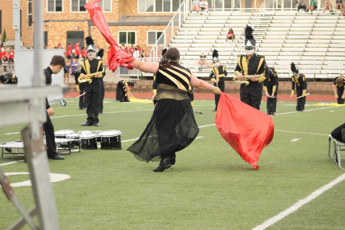 Ryley Heady (10) casting a spell over the percussionist and pit, putting them into a sleep while the rest of the band rose from their sleeping spell. 