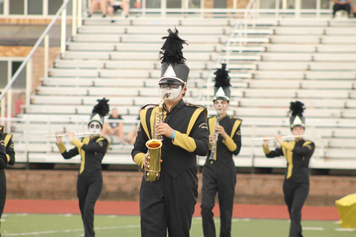 Matthew Heady (11), saxophone, playing his part at the Farmington Invitational. 