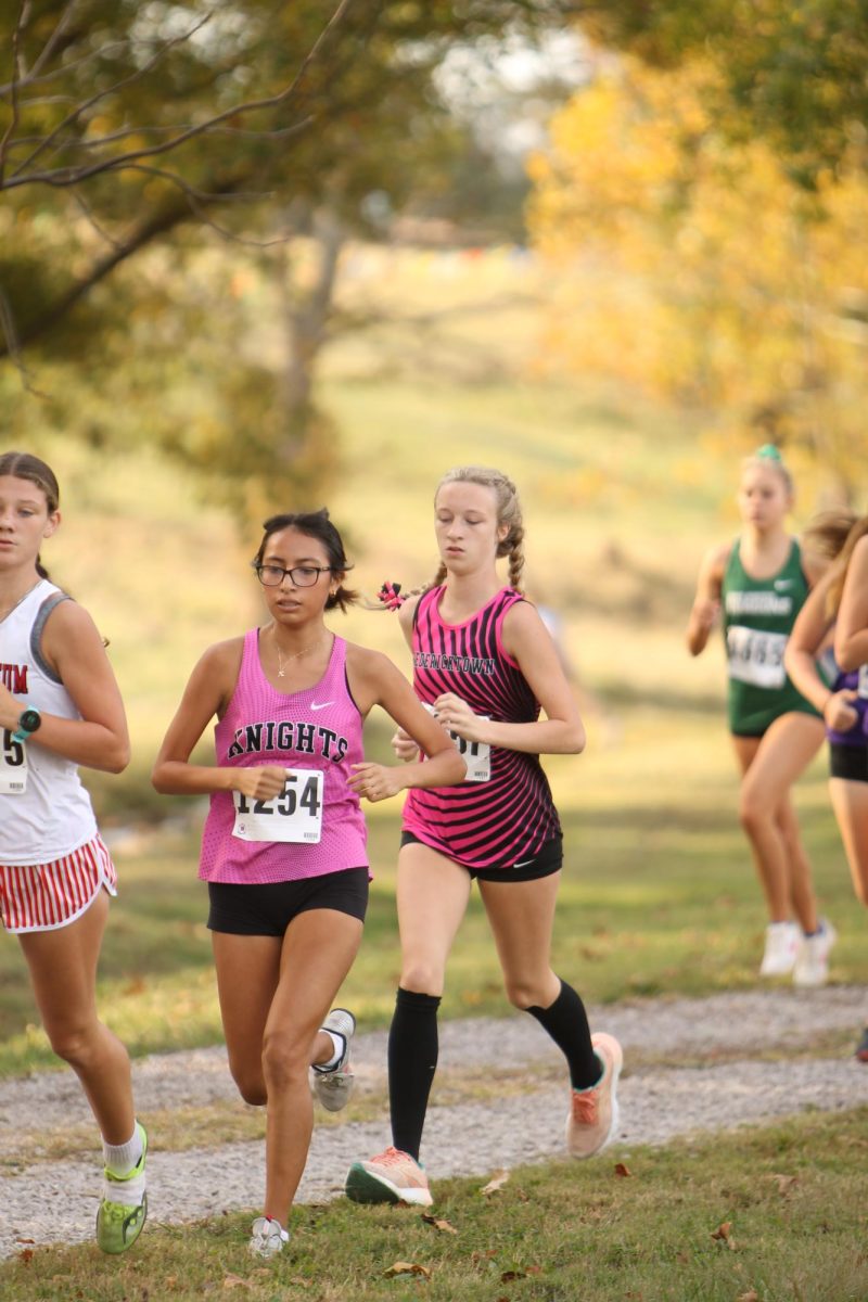 Breanna Bone (10) running in the cross country meet at Potosi