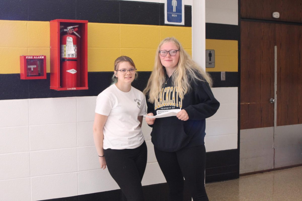 FCCLA members Emma Acosta (11) and Caylee Elrod (11) work behind the scenes to keep the show running.