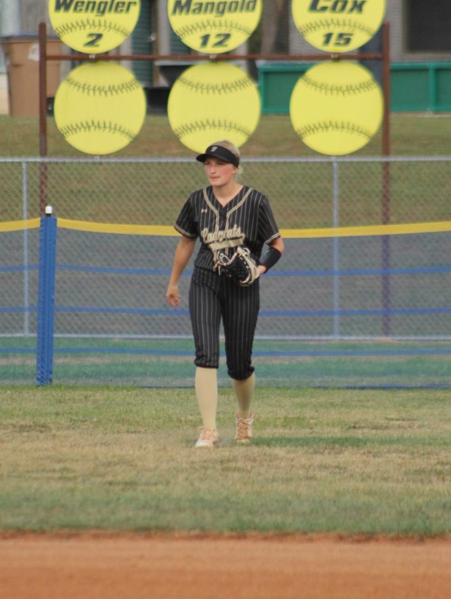 Becca Mangold (12) playing in the center field.