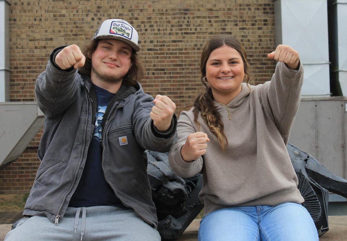 Braylon Barnett and Lauryn Mell posing for their "Class Chauffeurs" pictures.