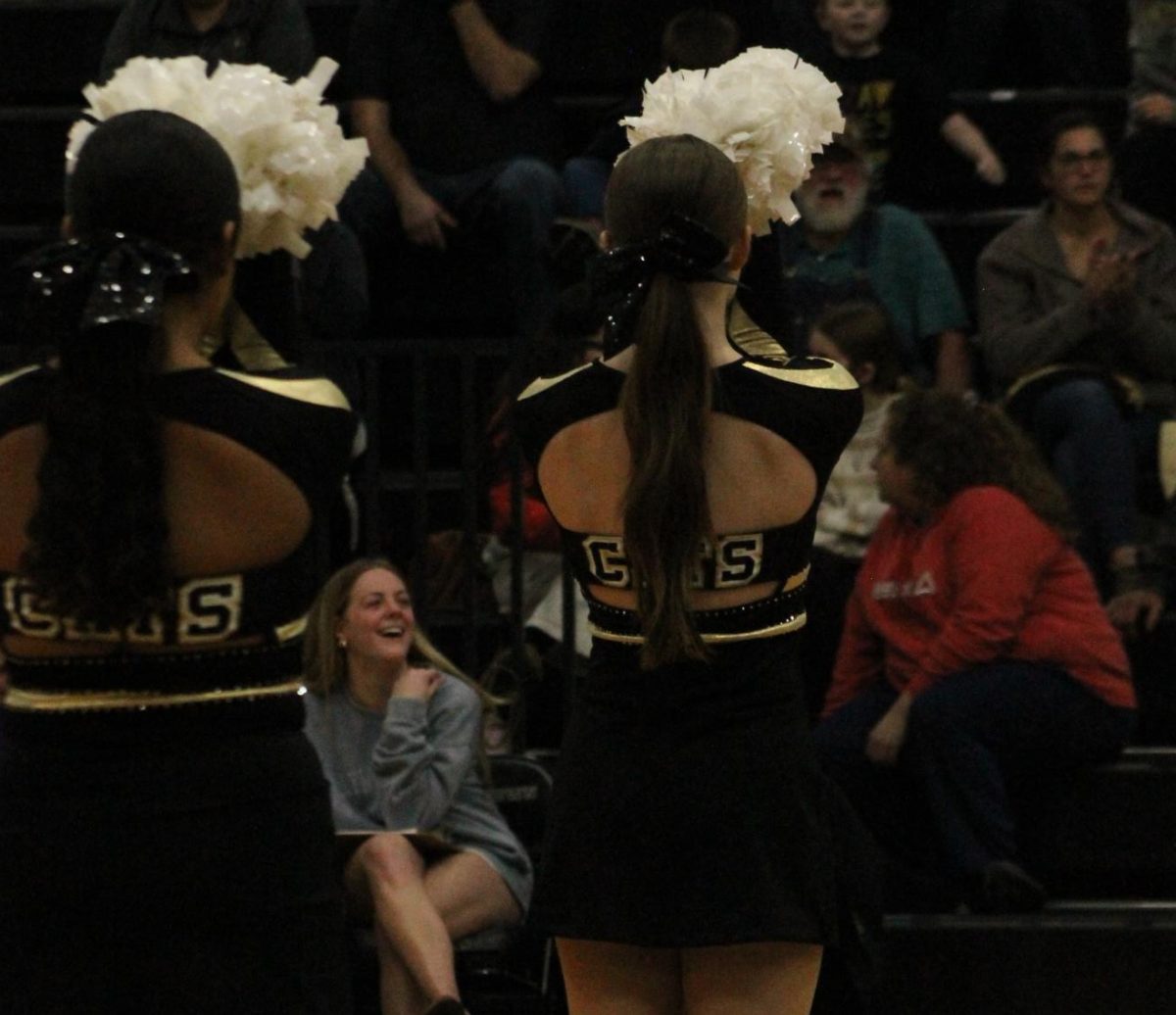 Callie Rice (12) and Brittany Avalos (10) preparing to perform at the Fredericktown vs. Bismark game.